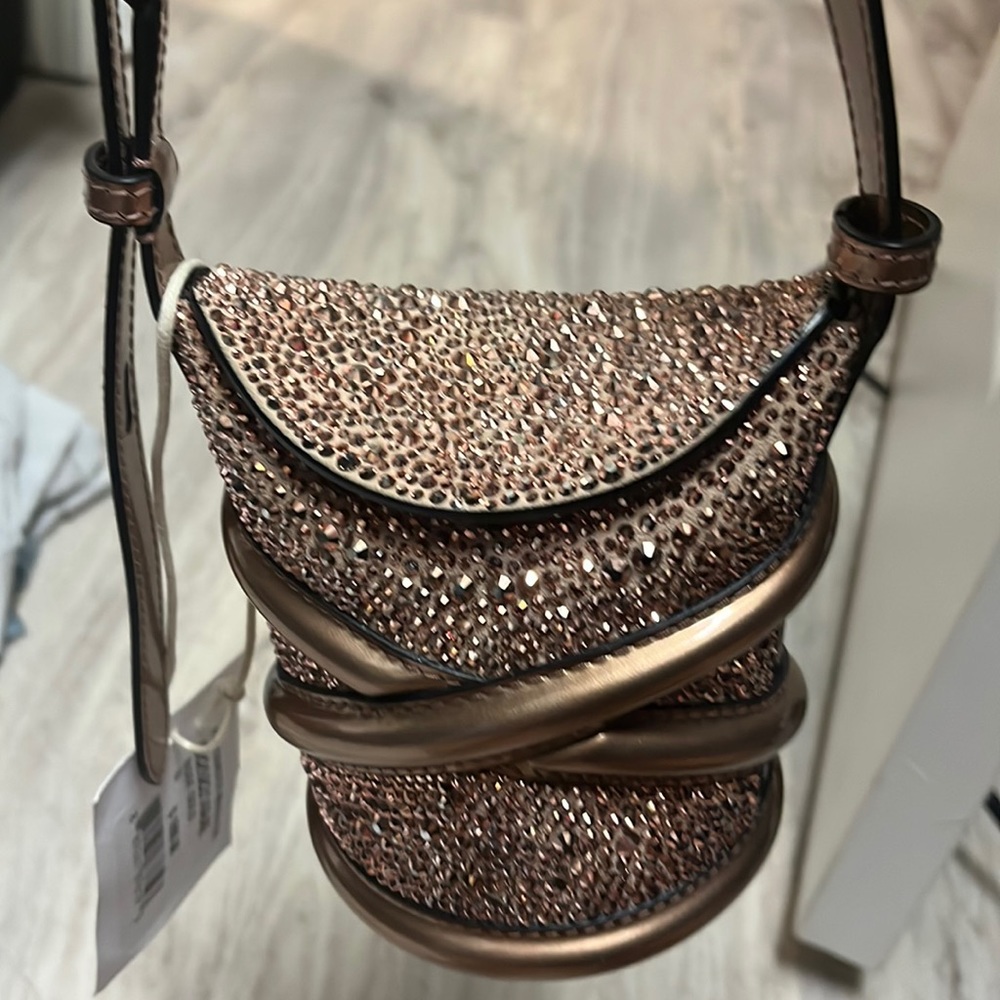 ALEXANDER MCQUEEN
Metallic Calfskin Crystal Mini Curve Bucket Bag Rose Gold